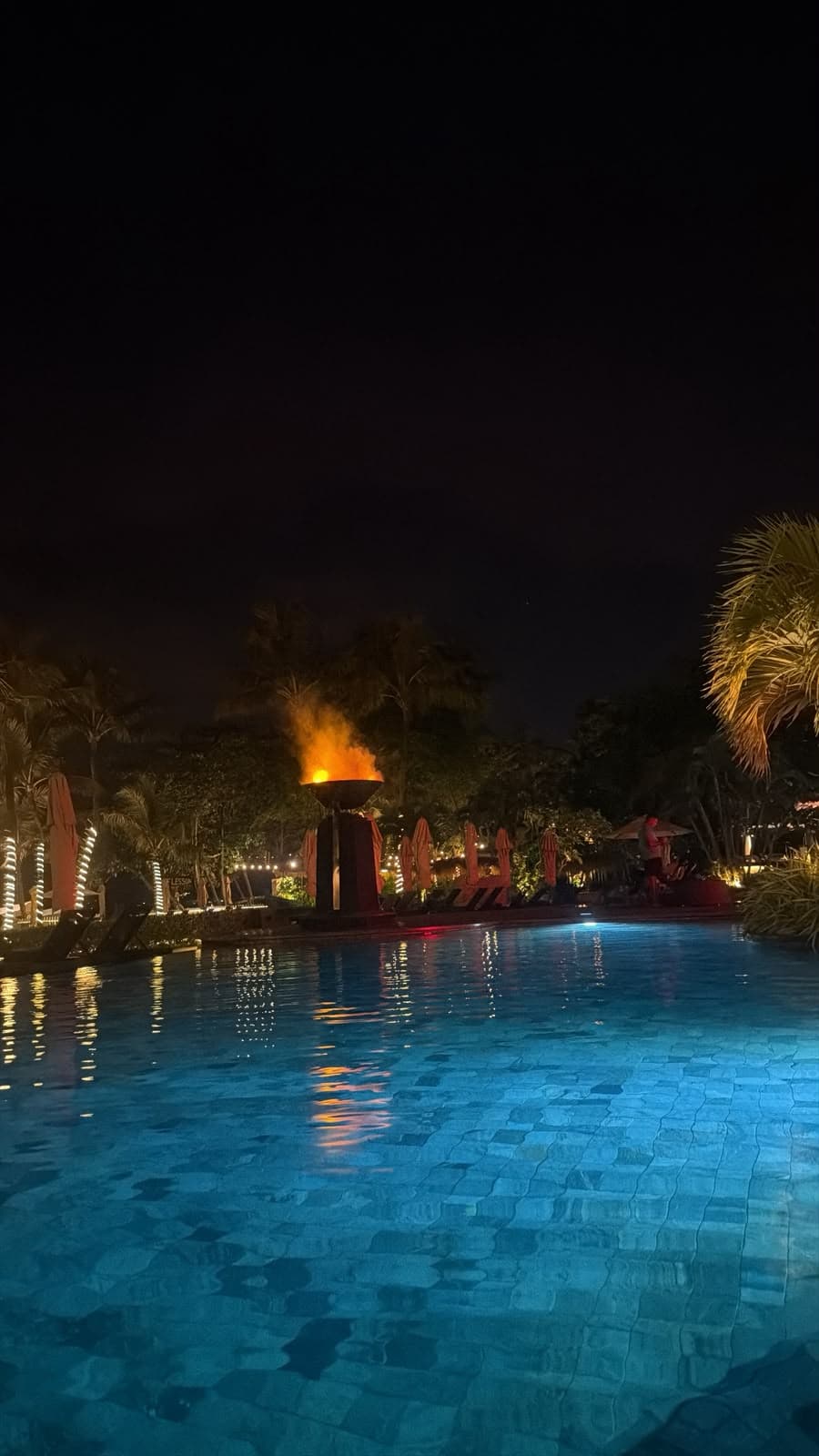 The pool and fire bowl after sunset